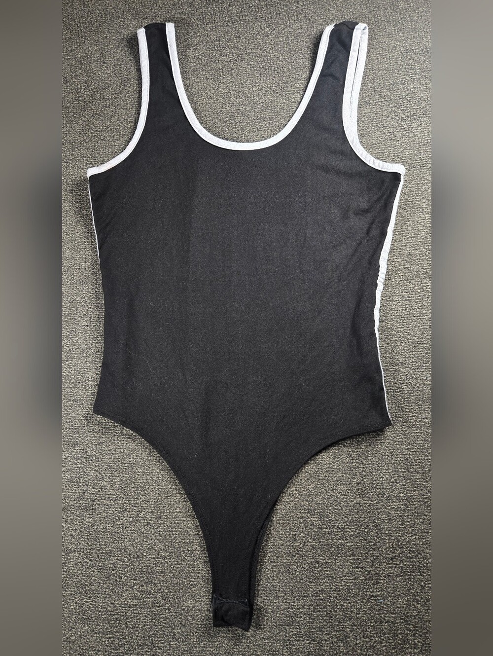 Discreet Black One-Piece Bodysuit with White Trim